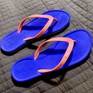 Under Armour flip flops for women  size 12.5 or (11in long) in purple & pink